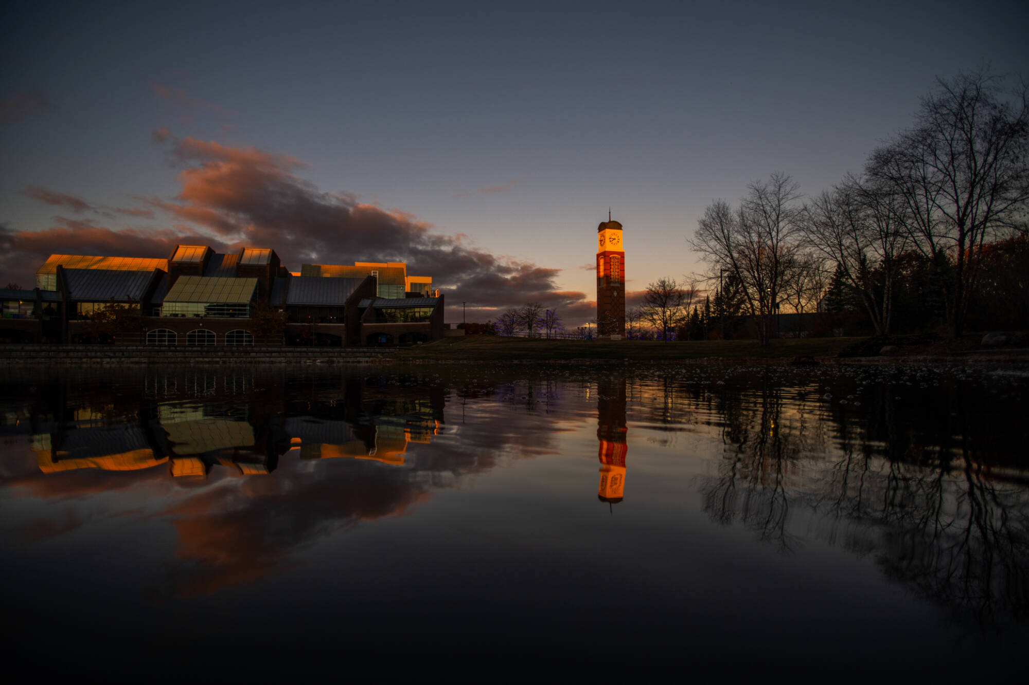 The Cook Carillon Tower is reflected into Zumberge Pond during a November 17 sunrise on the Valley Campus.